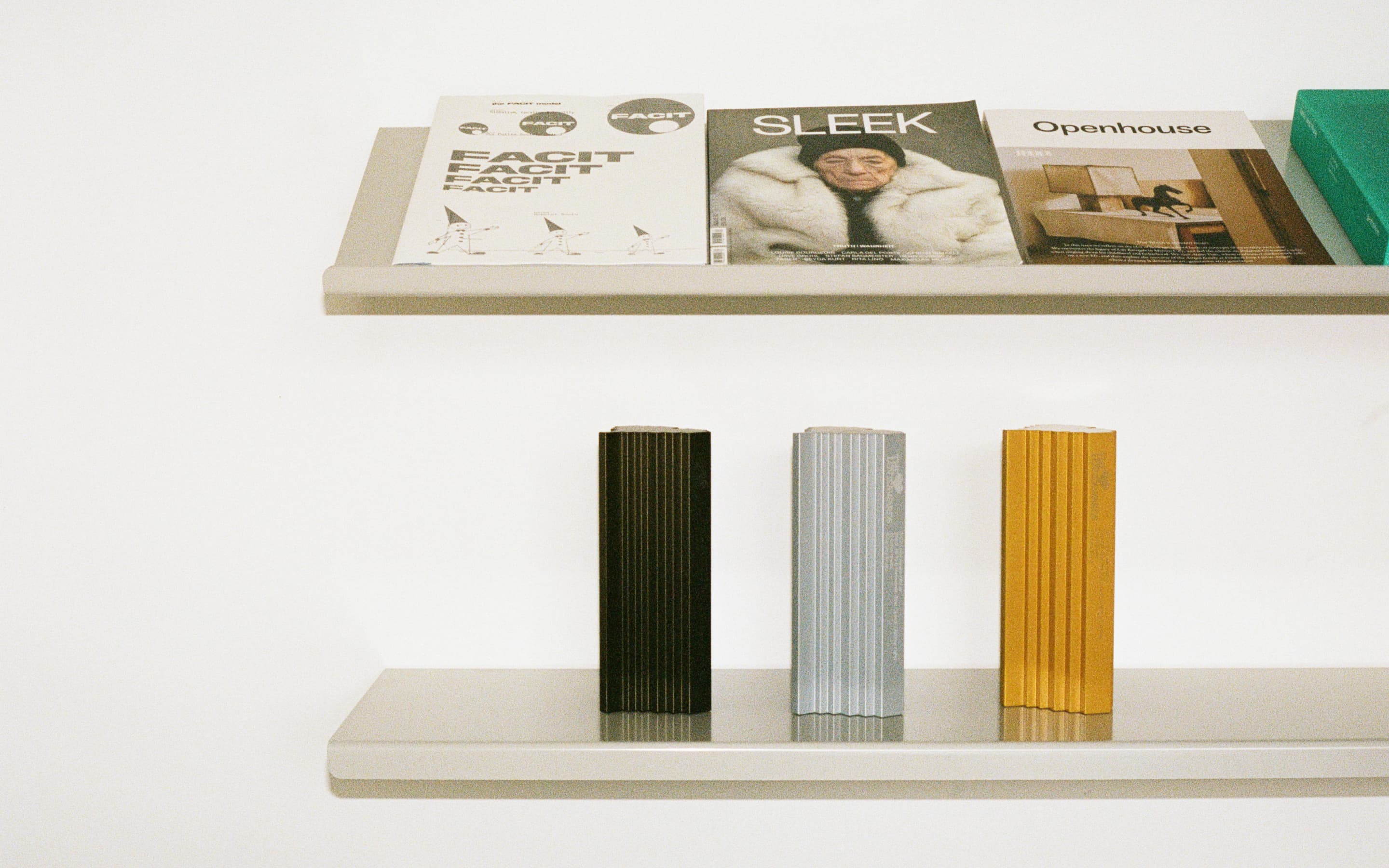 Various Magazines and Awards of Antinomy Studio on a shelf at the Amsterdam office